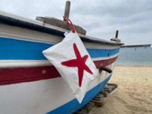 Tienda de bolsas náuticas AQUALATA Neceser de playa Estrella de mar Rojo Finisterre de Aqualata